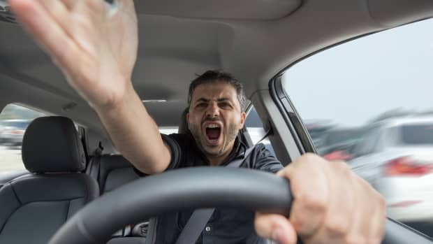 Angry man driving a vehicle